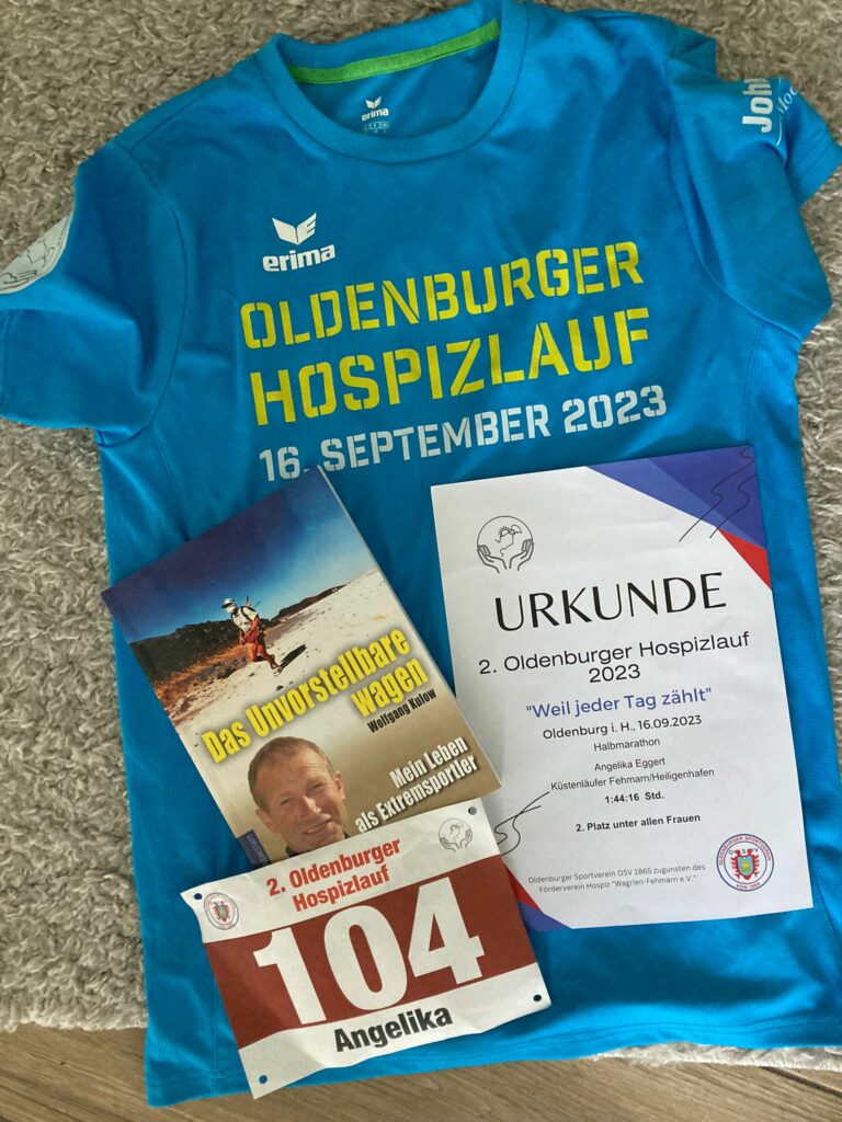 T-Shirt mit Urkunde und Buch von Wolfgang Kulow